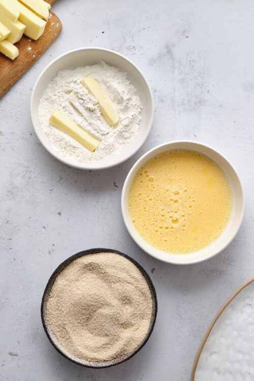 Flour, butter, eggs, and bread crumbs for baking, ready for cooking or baking preparation.