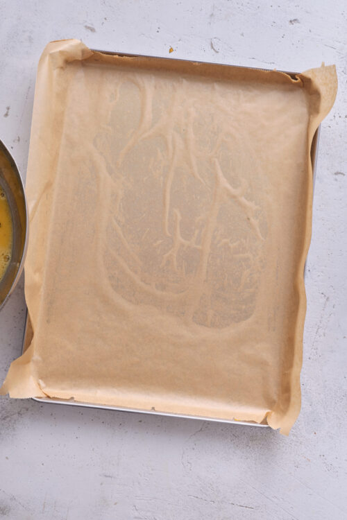 Baked Bree parchment paper-lined baking sheet for baking recipes and pastries.