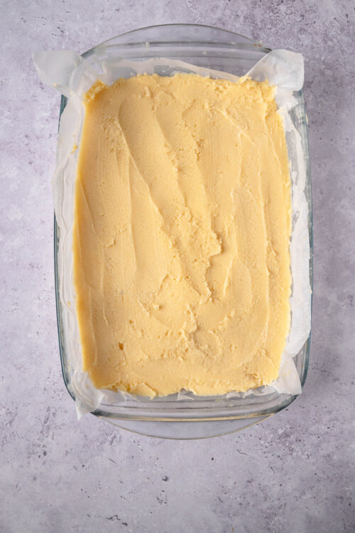 Creamy homemade vanilla ice cream in a glass container.