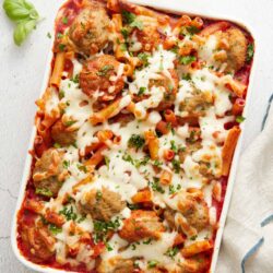 Savory baked spaghetti casserole with meatballs and melted cheese.