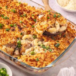 Creamy baked pasta casserole with breadcrumbs and green onions; comfort food recipe.