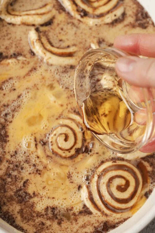 Creamy cinnamon roll batter with coffee and vanilla extract before baking.