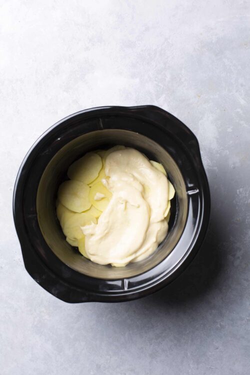 Cream and sliced potatoes in an Instant Pot for creamy mashed potatoes.