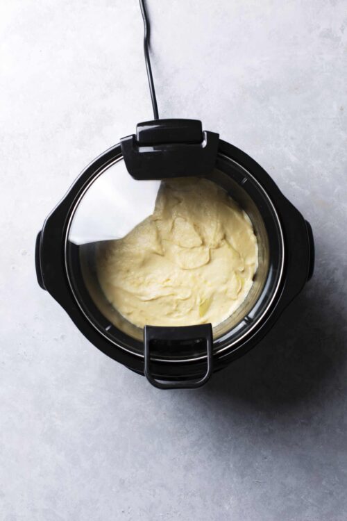 Creamy mashed potatoes in a black electric pressure cooker.