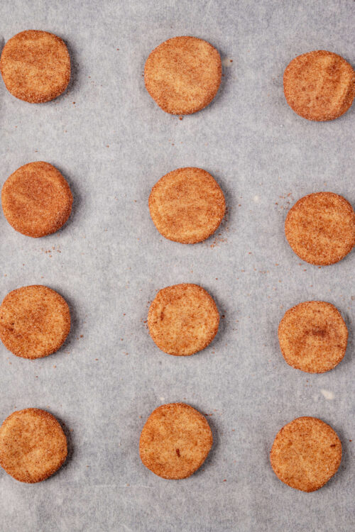 Crispy breadcrumb-coated croquettes on parchment paper, ready for baking or frying. Perfect snack or appetizer.