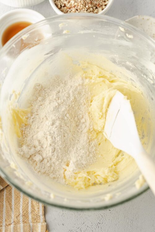 Buttercream frosting with flour and sugar in glass bowl for baking recipes.