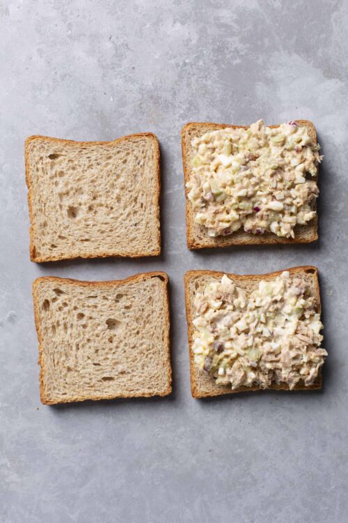 Butter sandwich with chicken salad on whole wheat bread, fresh homemade chicken salad on bread slices, simple and delicious lunch idea, Baked Bree recipe, bread and chicken salad.