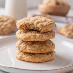 Butterscotch oatmeal cookies with a golden brown crust on a white plate.