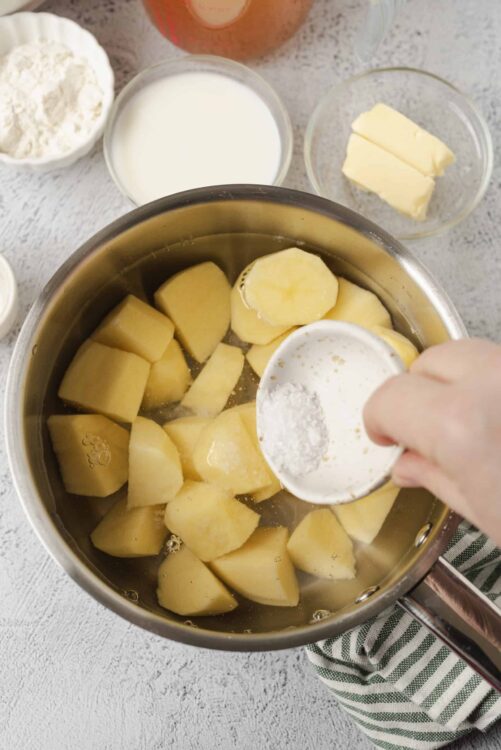 Butter melting with potatoes in a saucepan for baking recipes.