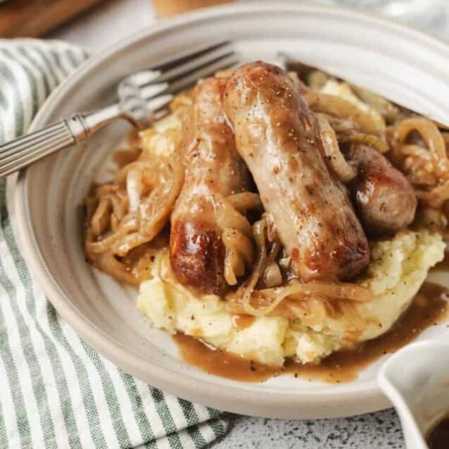 Juicy chicken drumstick with mushroom gravy over creamy mashed potatoes.
