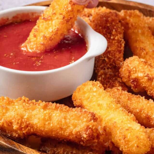 Crispy chicken tenders with dipping sauce, perfect baked appetizer or snack.