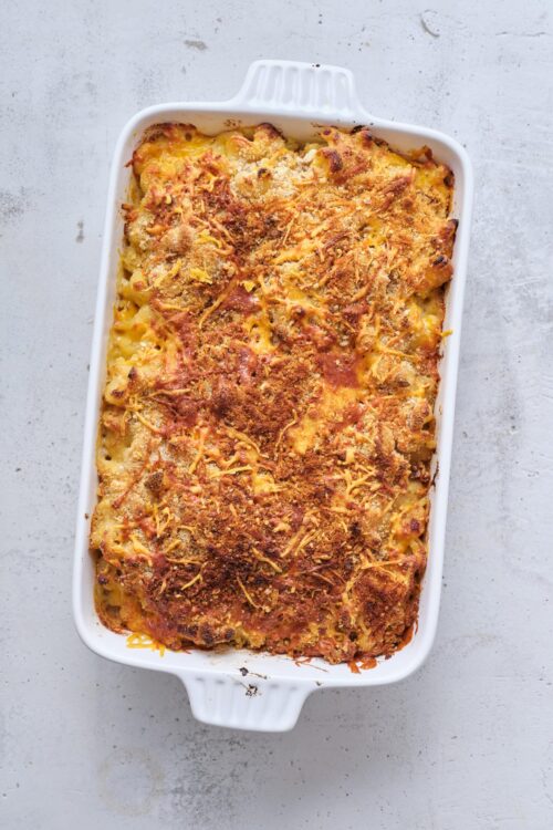 Creamy broccoli chicken casserole baked dish with golden breadcrumbs and cheese topping.