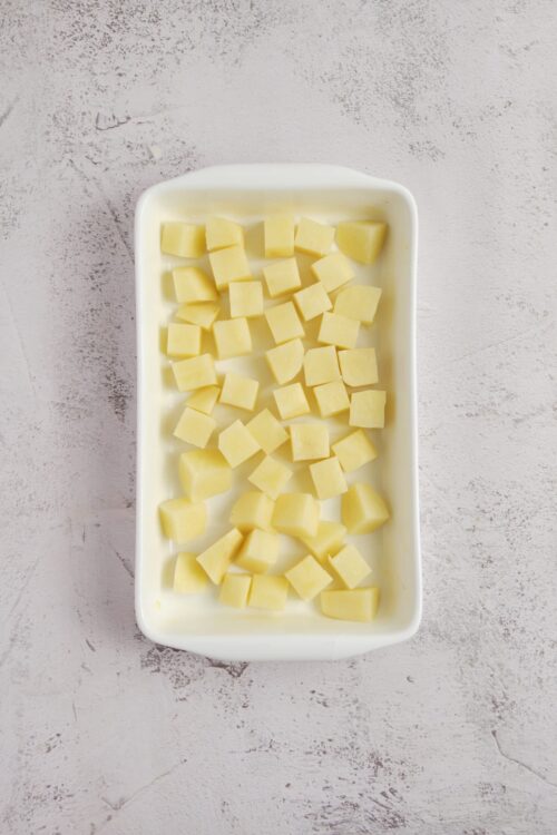 Butter cubes in a white dish for baking and cooking.
