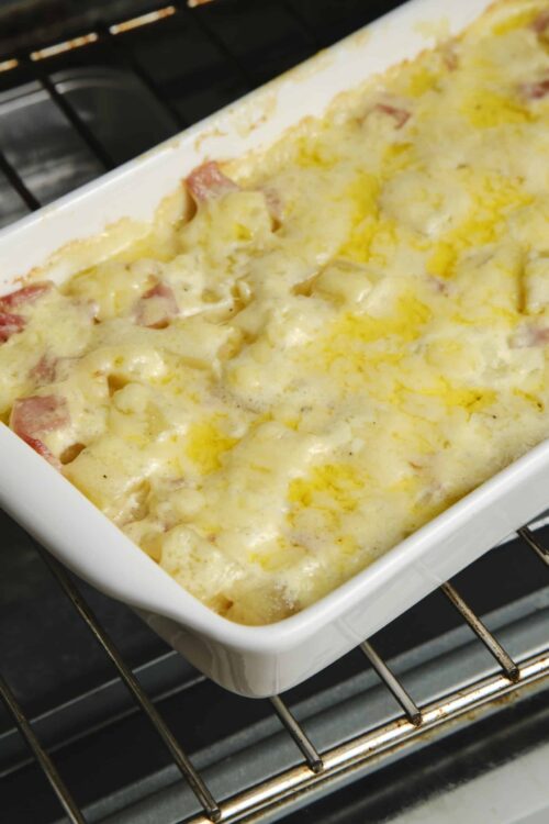 Creamy baked potato casserole with cheese and ham.