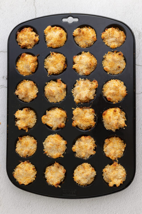 Buttered breadcrumb-topped mini pot pie casserole in muffin tin.