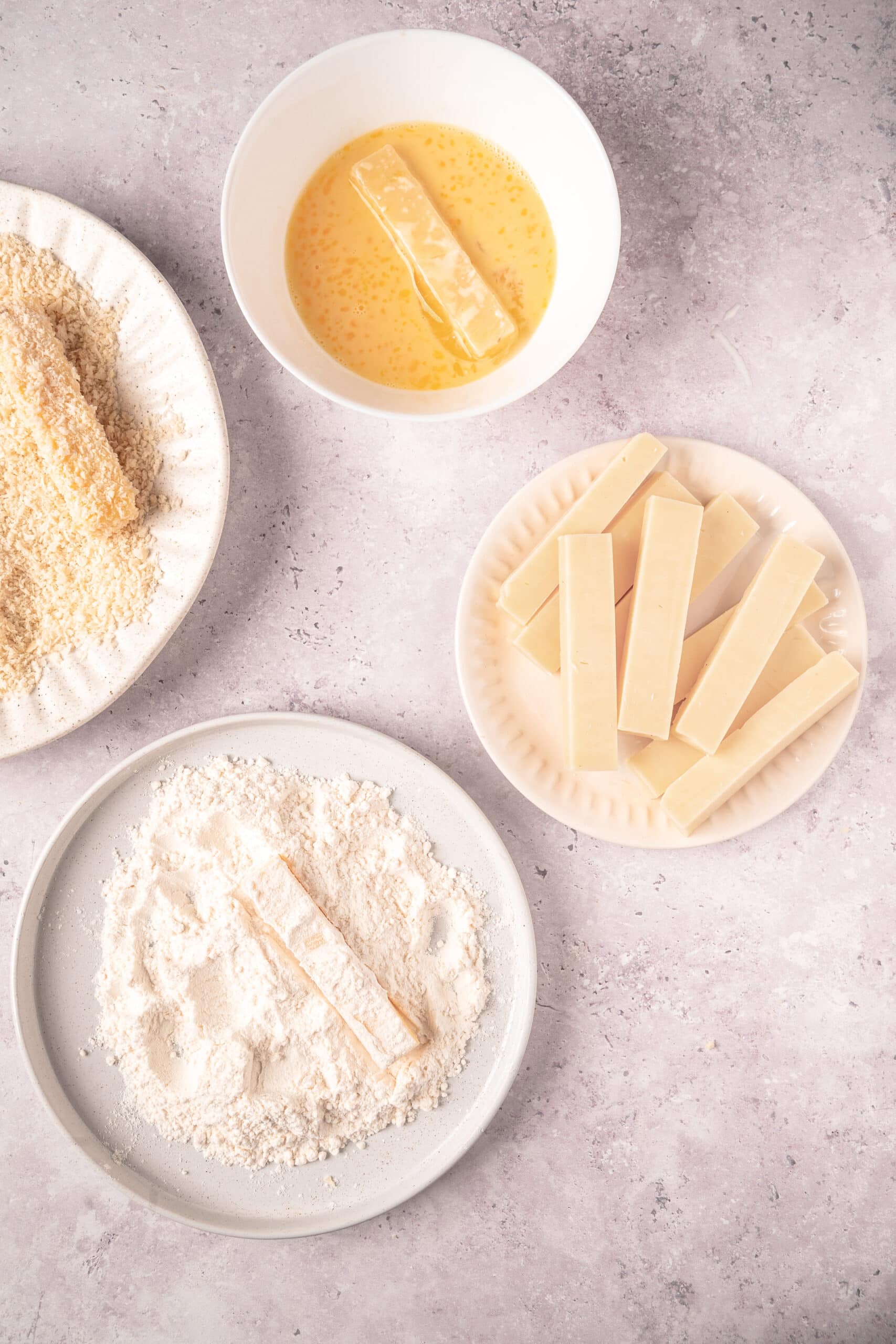 Cream cheese, butter, and white chocolate are melted for a baking recipe.