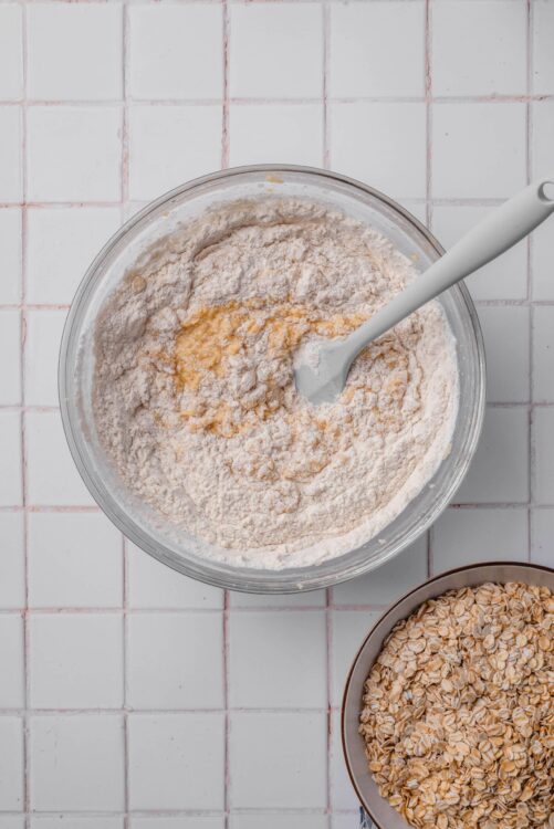 Flour and oats in mixing bowls for baked oatmeal recipe preparation.