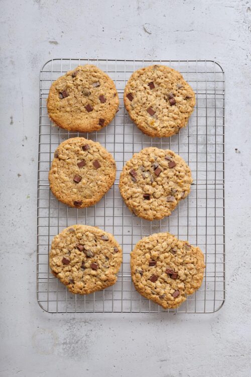 Soft chocolate chip cookies cooling on a wire rack.