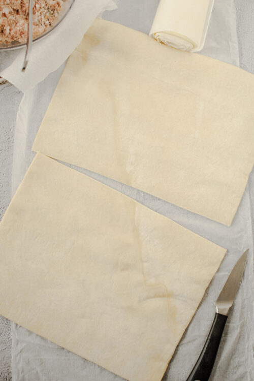 Thin puff pastry sheets for baking and recipe preparation.