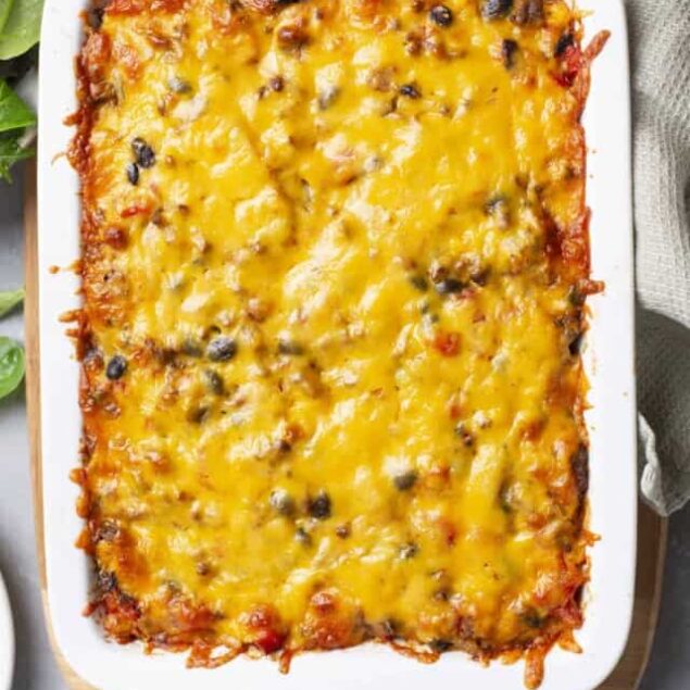 Cheesy baked enchiladas casserole with melted cheese and savory fillings.