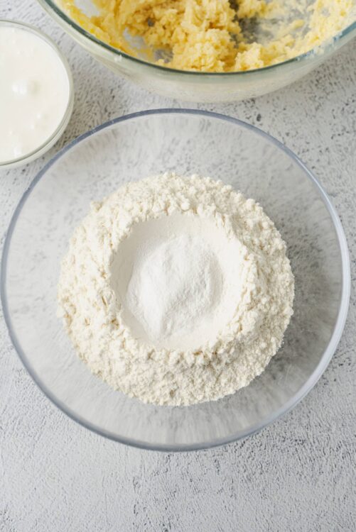 Flour mixture in a glass bowl for baking bread or pastries.