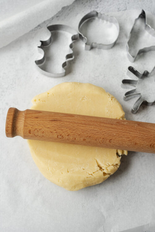 Butter cookie dough with rolling pin and cookie cutters, baking ingredients, ready to bake, bakedbree.com, Baked Bree, food preparation for cookies.