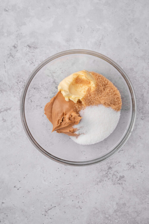 Cream cheese, brown sugar, vanilla extract, salt, and sweetened condensed milk in a glass bowl.