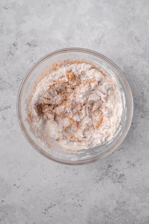 Flour mixture in a glass bowl for baking or pastry dough.