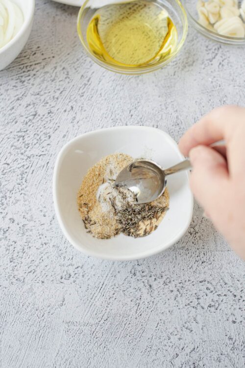 Ground spices and herbs in a white bowl for baking or cooking.