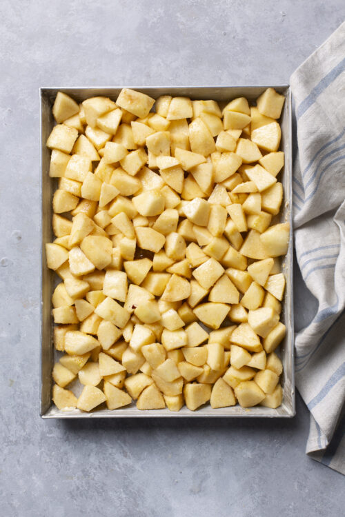 Diced peeled potatoes in a baking dish ready for roasting or making potato recipes.