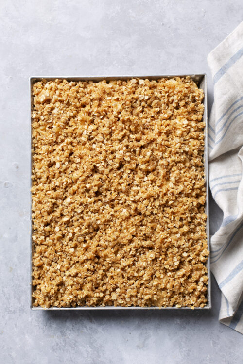 Golden brown crumble topping in a baking dish for dessert or fruit crisps.