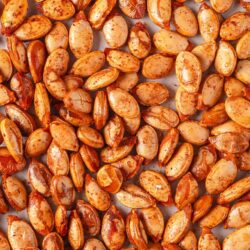 Roasted pumpkin seeds with a flavorful seasoning. Perfect snack, salad topping, or ingredient for baked goods.