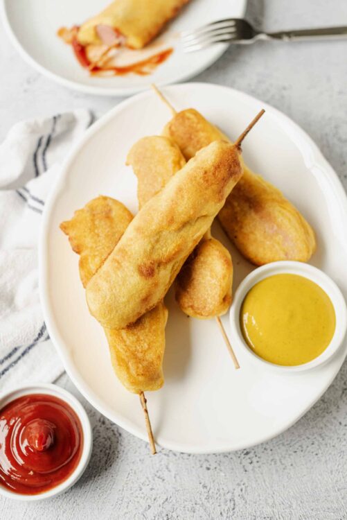 Crispy fish sticks with dipping sauces, baked Bree style.
