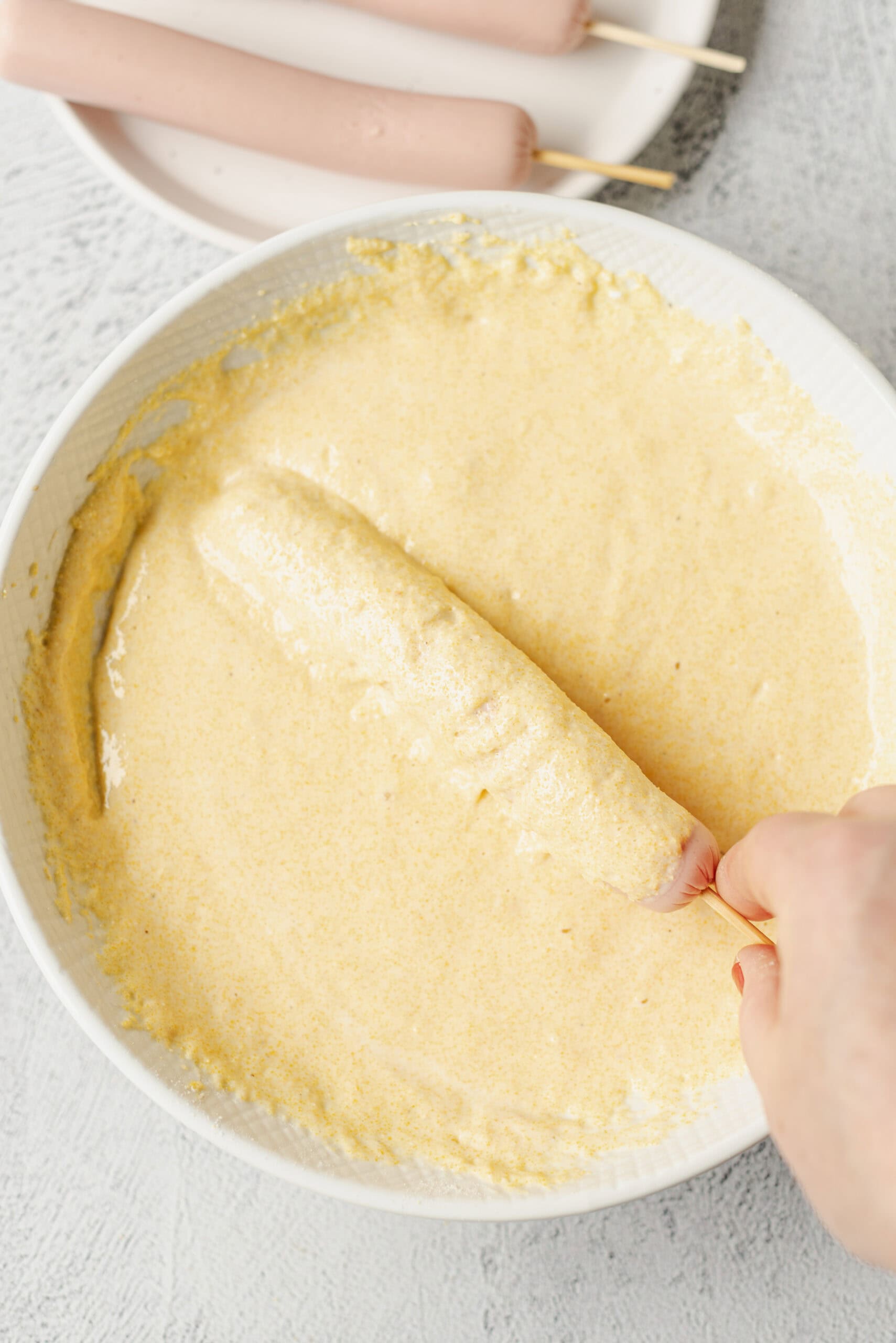 Creamy vanilla ice cream base in a white bowl for homemade ice cream.