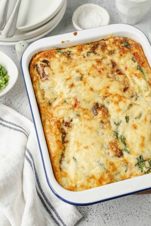 Creamy cheesy vegetable baked casserole with melted cheese and herbs.