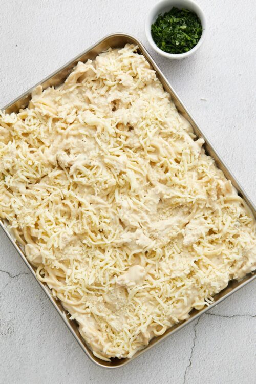 Creamy chicken and cheese baked casserole prepared with shredded cheese and herbs.