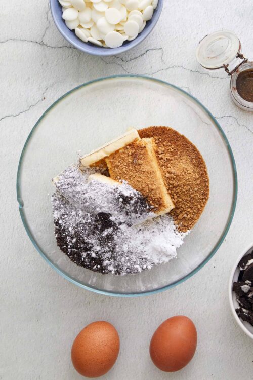 Butter, sugar, eggs, and baking ingredients for cookie dough.