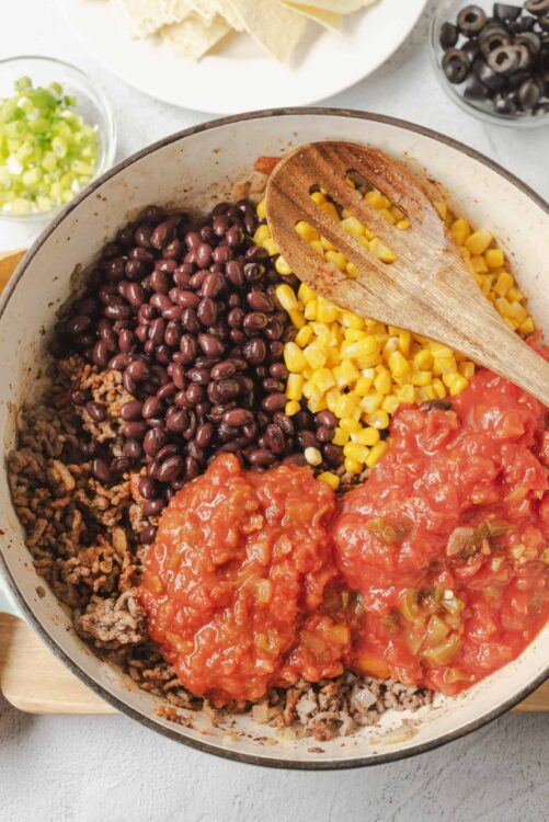 Canned black beans, corn, ground beef, and tomato sauce for easy Taco Soup. Perfect for quick weeknight dinners.