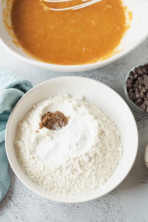 Creamy pumpkin soup with chocolate chips and spice mixture for baking.