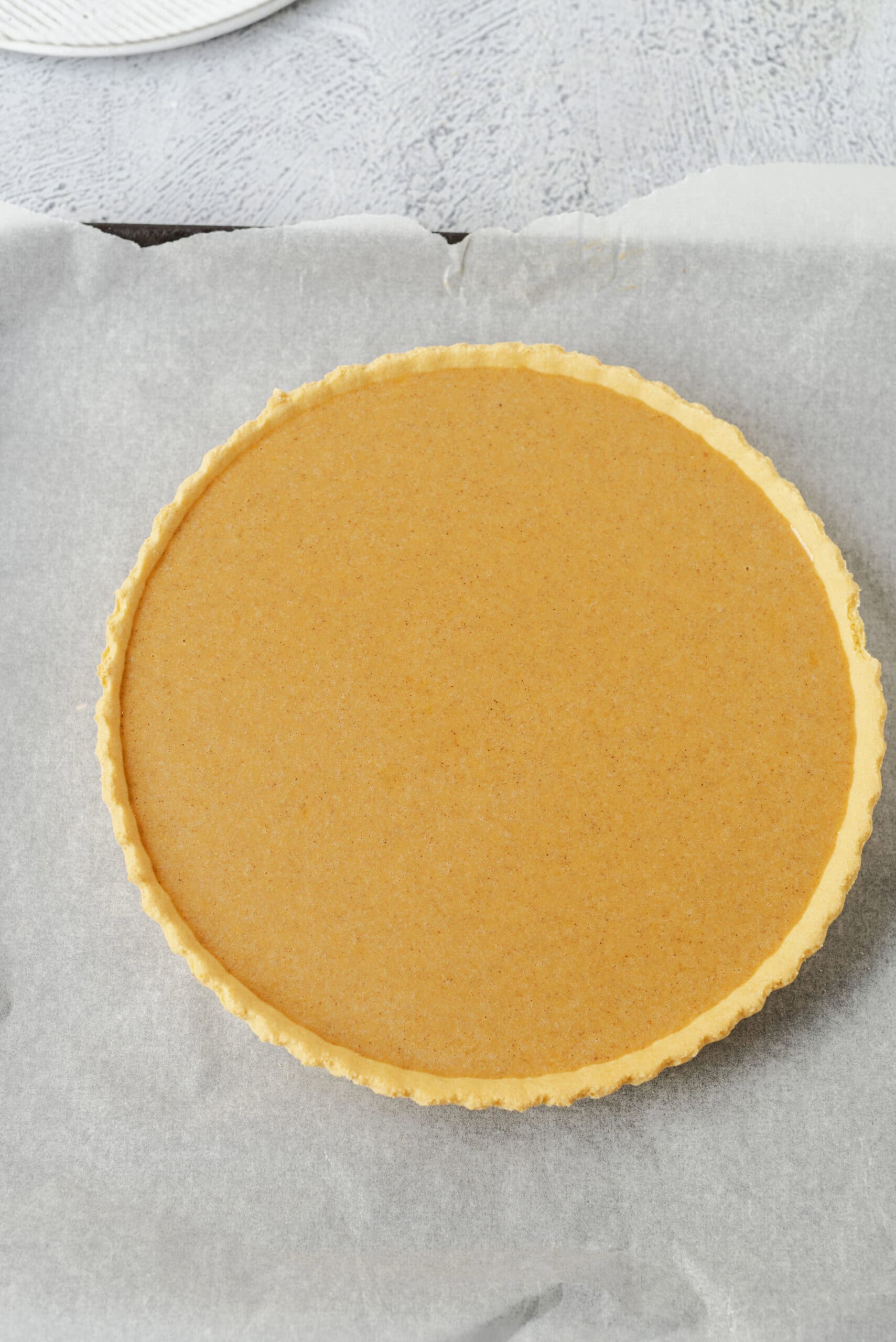 Creamy pumpkin pie with a buttery graham cracker crust, perfect for fall desserts.