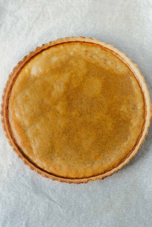 Golden baked lemon tart with flaky pastry crust.