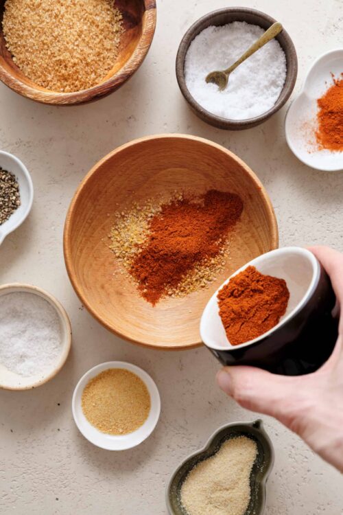 Ground spices and seasonings in bowls, preparing for a flavorful cooking or baking recipe.