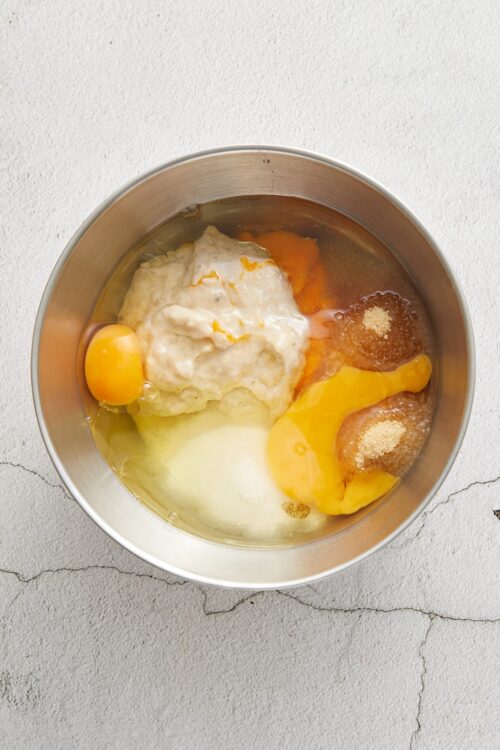 Mixing eggs, sugar, and flour for baking recipes.