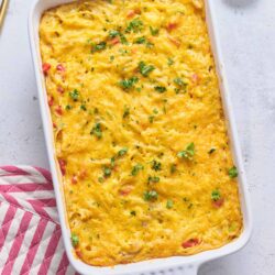Creamy baked cheesy casserole with melted cheese and fresh herbs, perfect comfort food.