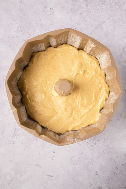 Butter cake batter in a silicone mold for baking, batter ready for oven, baking process, dessert preparation, sweet baked goods preparation.