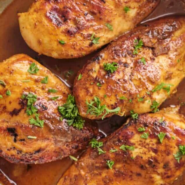 Juicy baked chicken thighs with herbs and spices, perfect comfort food.