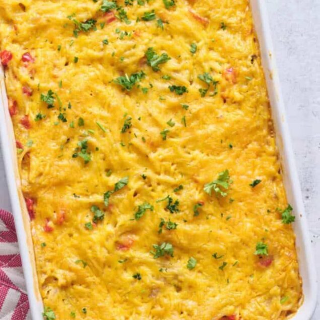 Creamy baked mac and cheese with a golden cheesy crust, topped with fresh parsley. Perfect comfort food recipe.