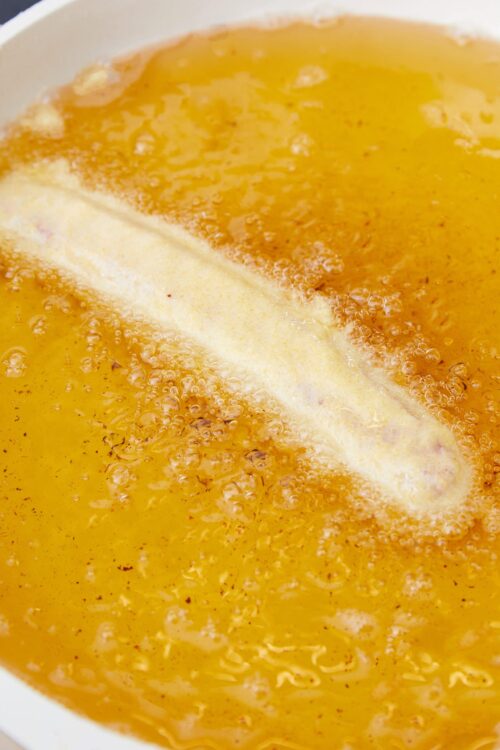 Creamy chicken soup with bubbling broth and a seasoned broth.