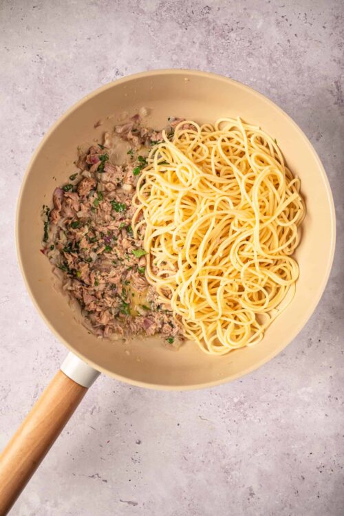 Savory tuna and spaghetti skillet with herbs and onions.