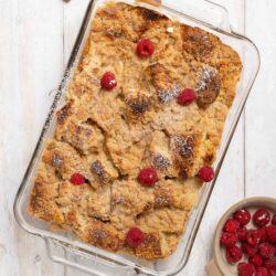 Butterscotch Crumble Dessert with Raspberries in a Glass Baking Dish.